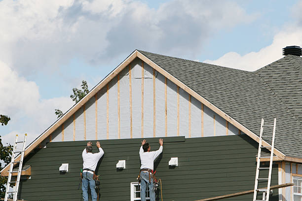 Professional Siding technician working in Bellmore, NY